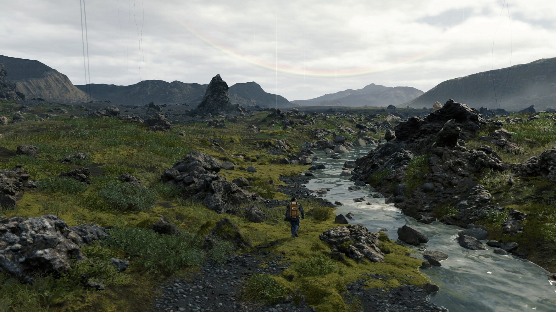 Death Stranding Norman Reedus walking through countryside
